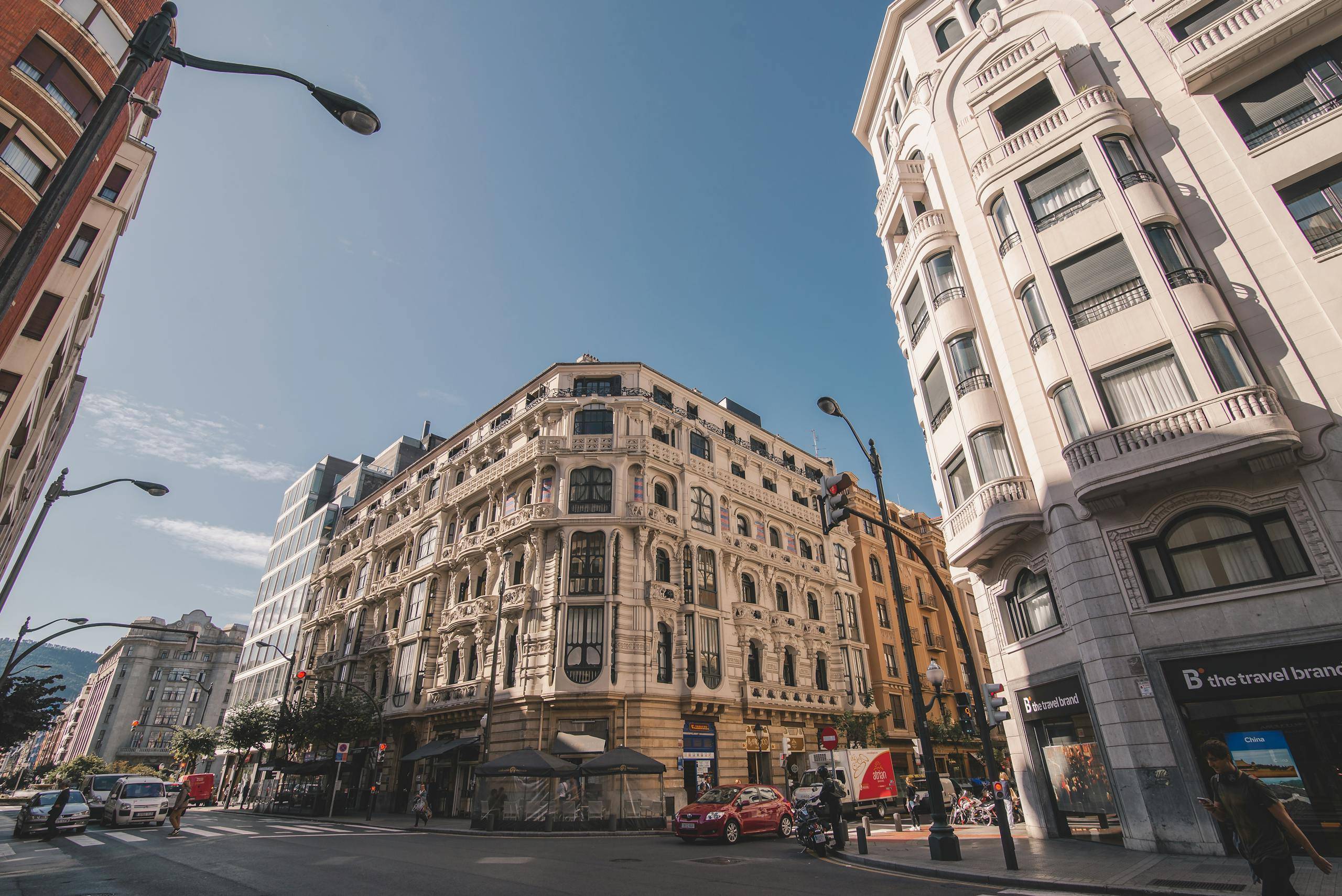 Low-angle view of classic architecture in vibrant Bilbao, Spain cityscape.